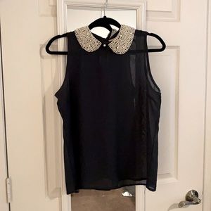 Dark teal sleeveless sheer blouse with pearl Peter Pan collar.